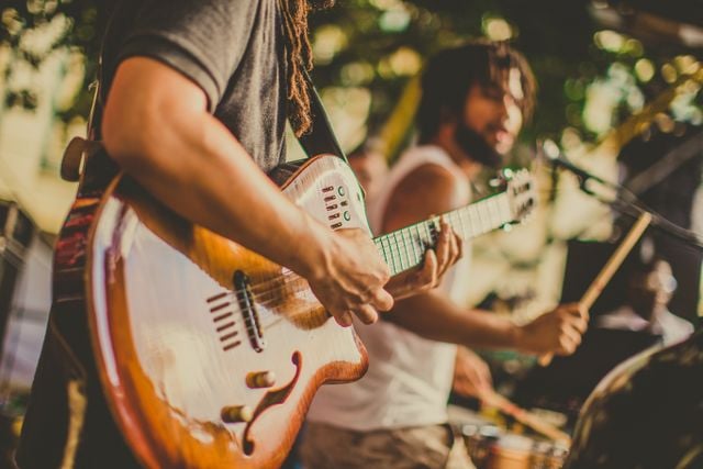 Brazilian musicians performing live guitar and percussion music