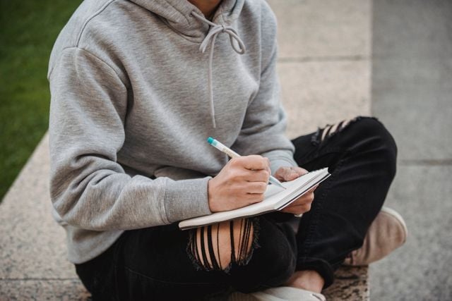 A Turkish students writing down notes.